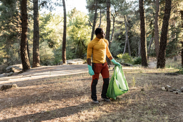 istock Eco-Conscious Hiker Helping to Clean Up the Forest 2150590603