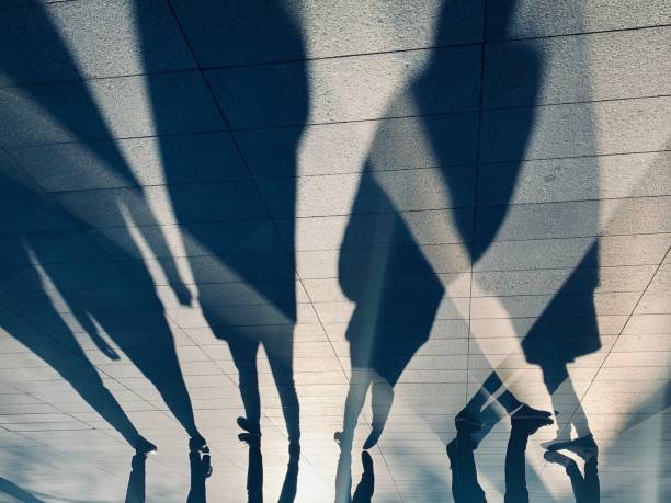 Long shadows of people