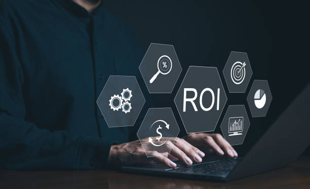 istock Analyzing Return on Investment ROI on Laptop. A businessman is using a laptop with graphics representing ROI analysis, including financial growth symbols and analytics tools. ROI indicator concept. 2150592872