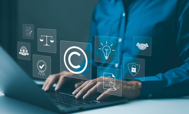 istock Copyright or patent concept. Professional working on a laptop with digital icons representing intellectual property and digital copyright law. Trademark license, copyleft, Rights symbol, Piracy crime, 2150592882