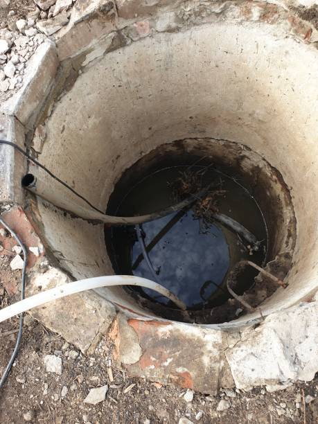 istock old water well, replacement of water pipes 2150594632