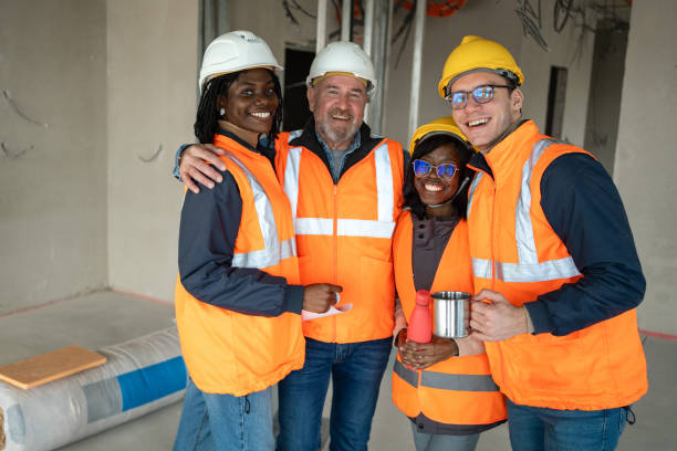 istock Portrait of happy construction workers at construction site 2150598824