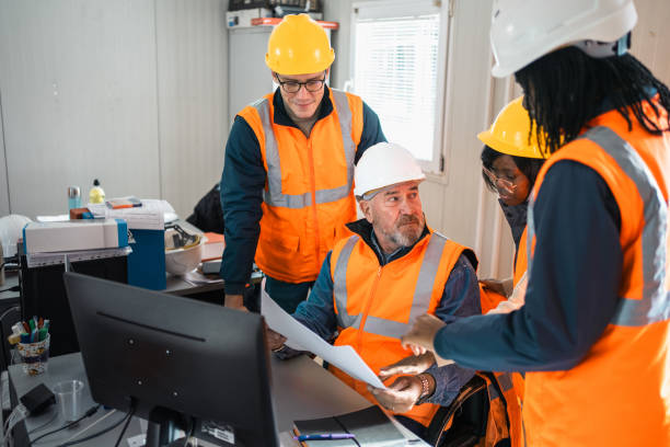 istock Building contractor and engineers working in office at the construction site 2150598940