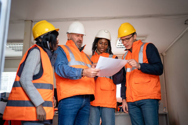 istock Building contractor and engineers working in office at the construction site 2150598942
