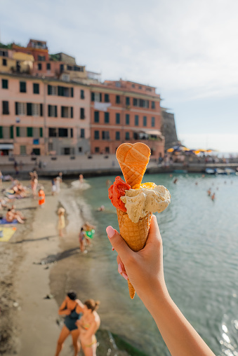Gelato  in cone on the background of Cinque Terre in summer