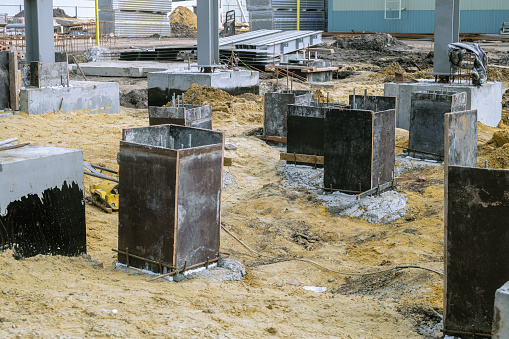 Formwork shields for the foundation construction of reinforced concrete monolithic structures on building site. Grillages.