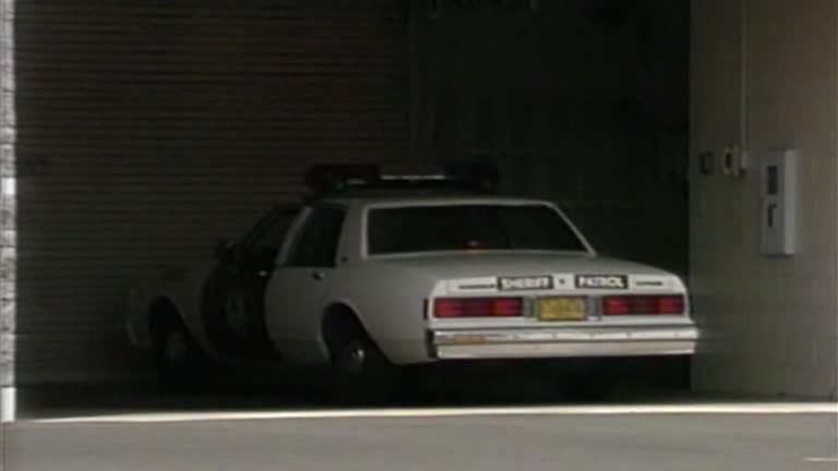 1990s SHERIFF PATROL COP CAR RETURNING BACK TO HQ