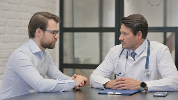 istock Man Discussing Health Issues with Doctor 2150602836