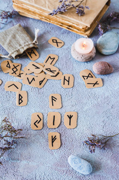 istock Fortune telling from four Scandinavian runes on a table in mystical decor vertical view 2150602846