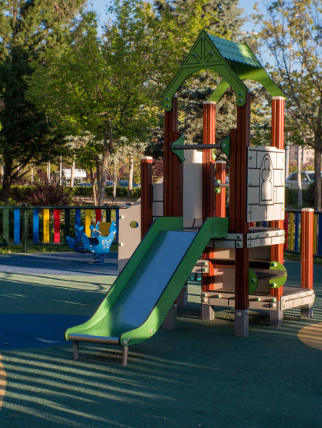 istock Children's swing in a city park 2150603839