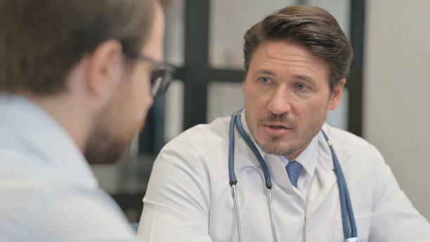 istock Close up of Doctor Talking with Patient 2150604164