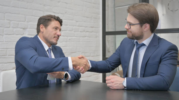 istock Business People Shaking Hand after Payment 2150605652