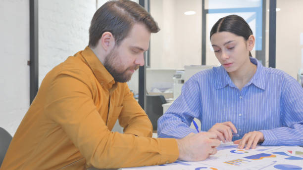istock People Working on Business Report in Office 2150608038