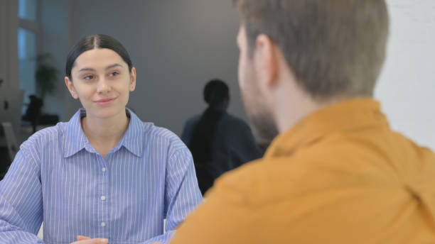 istock Mixed Race Entrepreneurs Discussing Business in Office 2150609065