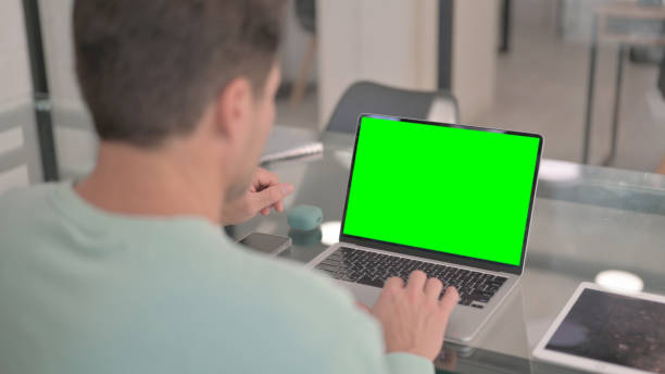 istock Working on Laptop with Green Screen Chroma Key 2150609277