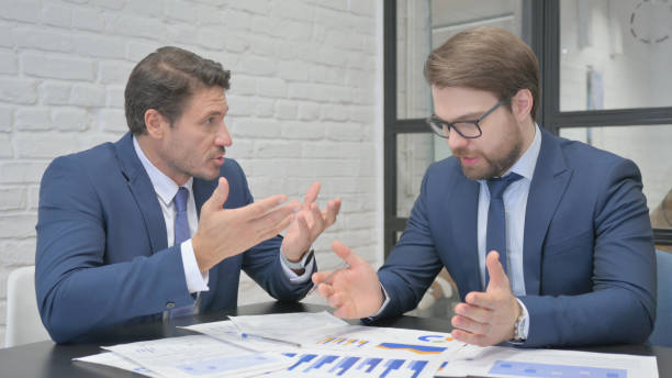 istock Angry Businessman Talking in Meeting with Teammate 2150609648