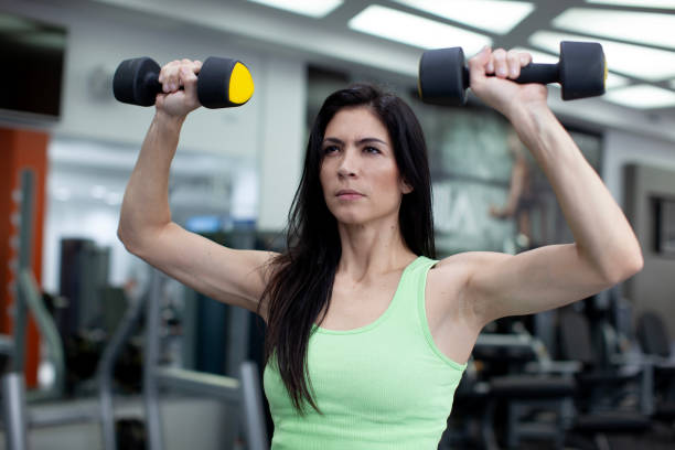 istock Woman working out at the gym 2150609678