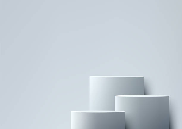 istock 3D white three podiums in various sizes sits on a white background, Minimal style, Product display, Mockup, Showcase, Showroom presentation 2150610358