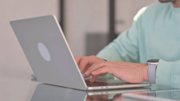 istock Close up of Man Typing on Laptop 2150610906
