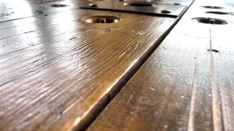 Super close-up the wooden table in a rustic restaturant.