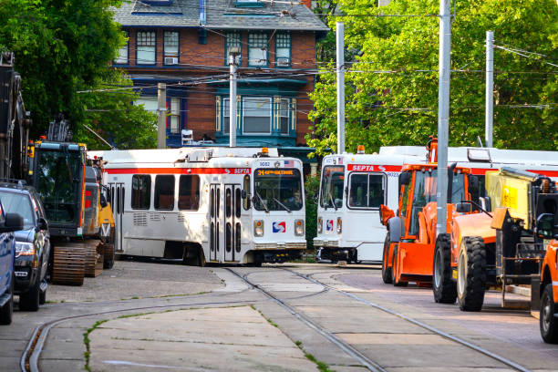 Two SEPTA trolleys meet in Philadelphia at 40th Street portal.