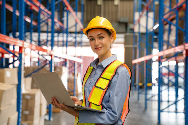 istock Portrait of female worker using laptop working in warehouse. 2150614492