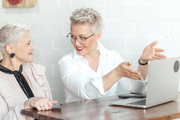 istock worker show presentation for her female boss or client 2150615984
