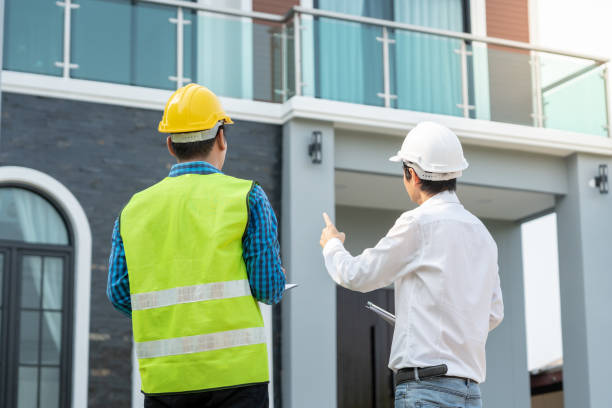 istock inspector engineer and owner project is inspecting construction and quality assurance new house. Engineers or architects or contactor work to build the house before handing it over to the homeowner 2150616801