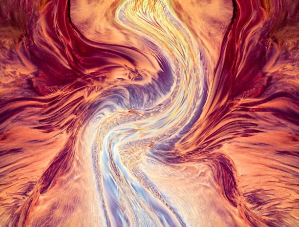 The winding river flows into the sea like dancing ribbons.