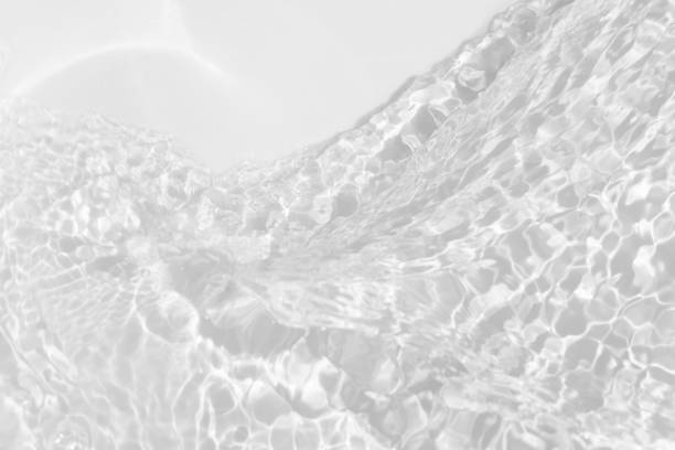 istock Bluewater waves on the surface ripples blurred. Defocus blurred transparent blue colored clear calm water surface texture with splash and bubbles. Water waves with shining pattern texture background. 2150621167