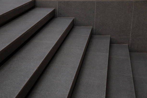 istock The staircase is covered with dark gray stone and has 6 steps. 2150626406