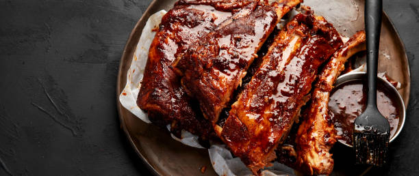 istock Grilled and smoked ribs with barbeque sauce. 2150627317