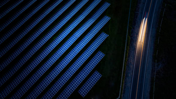 istock Blue Hour Solar Panels Highway Traffic 2150628402