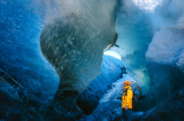 istock Asian Chinese mature man exploring Ice Cave in Iceland 2150629762