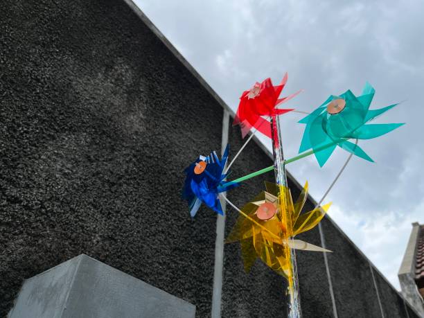 istock Windmill toys spinning in the wind under the sky 2150630373
