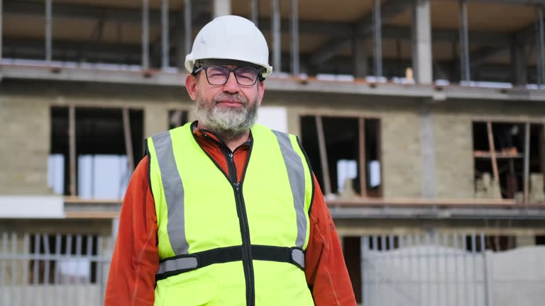 Portrait construction man, positive mature engineer, builder, building and inspection