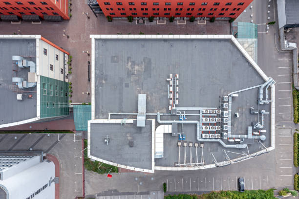 istock roof of a small office building with efficient ventilation system and air conditioning equipment. aerial top view. 2150633284
