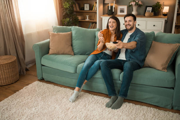 istock Couple watching a movie at home. 2150634099