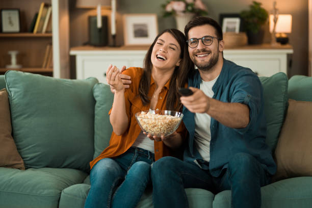 istock Couple watching a movie at home. 2150634209
