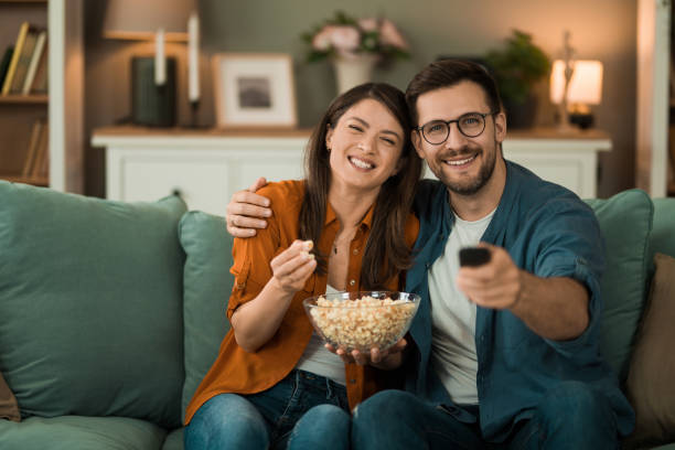 istock Couple watching a movie at home. 2150634247