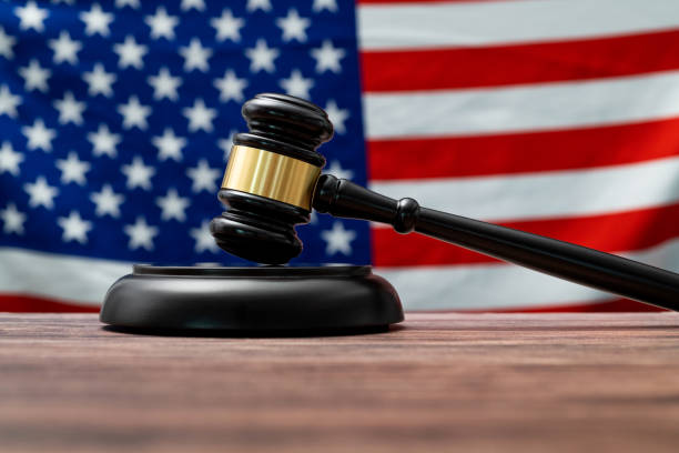 istock Wooden gavel and American flag 2150634705