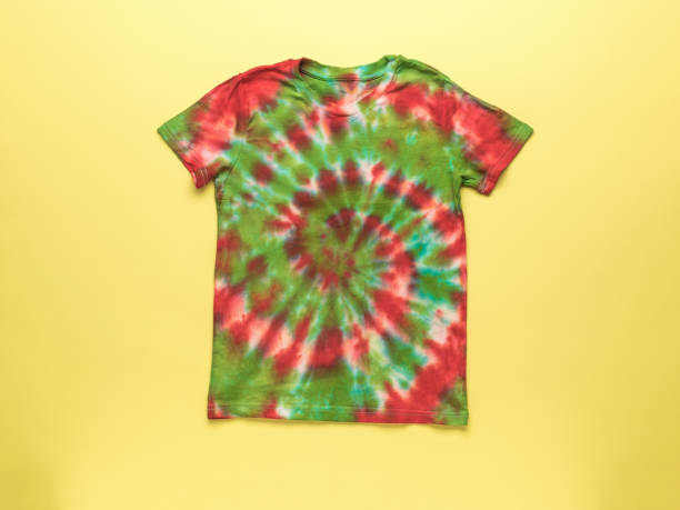 istock Tie dye T-shirt on a bright yellow background. 2150634738
