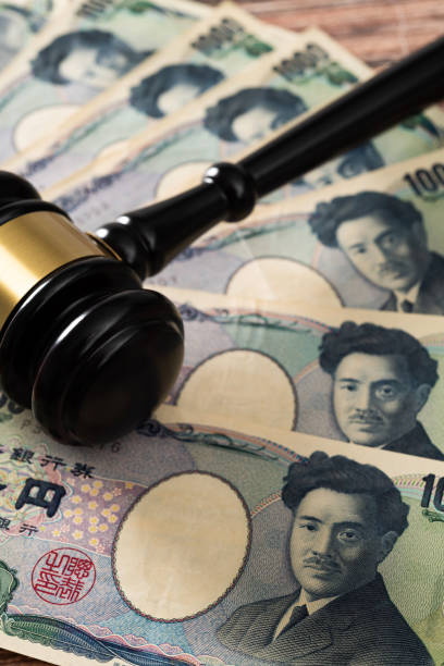 istock Gavel and stack Japanese currency on the table 2150634786
