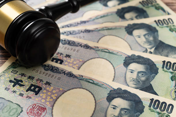istock Gavel and stack Japanese currency on the table 2150634787