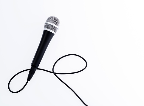 Microphone with cable on white background.
