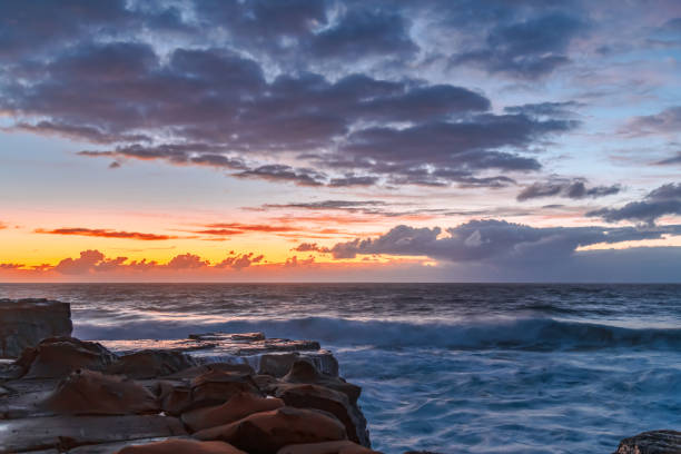istock Sunrise, sea, waves, clouds and tessellated rock platform 2150636466
