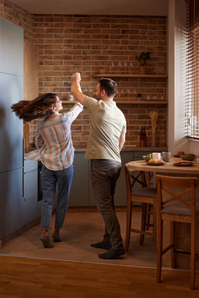 istock Happy couple having fun while dancing at home. 2150641781