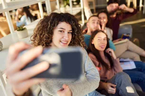 istock Happy college students taking a selfie with cell phone at campus. 2150642887
