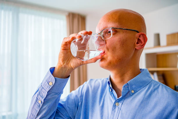 istock Young man Cancer patients drink water 2150643127