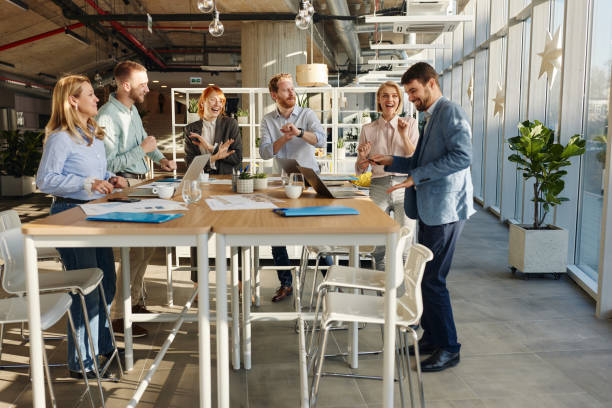 istock Team of happy colleagues dancing in a modern office. 2150643203